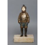 AFTER H. MABEL WHITE (1870-1948) an Art Deco bronze and ivory figure cast as a young Eskimo boy