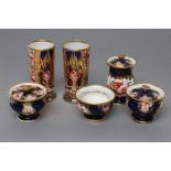A PAIR OF SPODE PORCELAIN SPILL VASES, c.1810, of plain cylindrical form, painted in Imari 1409