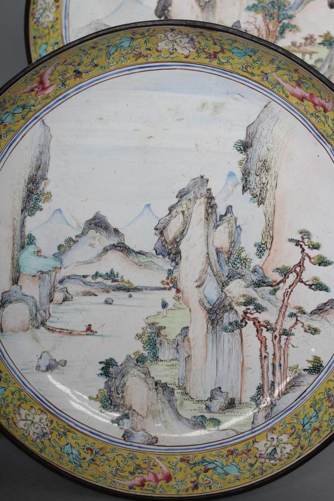 A PAIR OF CANTON ENAMEL SAUCER DISHES centrally painted in pastel colours with figures in - Image 5 of 8