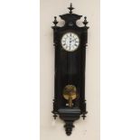 AN EBONISED CASED VIENNA WALL CLOCK, with single weight driven movement, 6 1/4" two piece dial