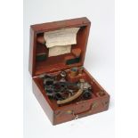 A SEXTANT by Heath & Co. London, the ebonised frame with brass and silvered scale, and bakelite