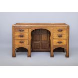 A ROBERT THOMPSON ADZED OAK PEDESTAL DESK, 1930/40's, the rounded oblong top with ledge back and saw