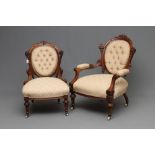 A LADY'S AND A GENTLEMAN'S VICTORIAN WALNUT SHOW FRAME EASY CHAIRS, both button upholstered in a