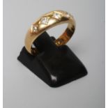 A VICTORIAN 22CT GOLD AND DIAMOND RING, the plain band gypsy set with five old mix cut stones,