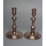 A PAIR OF GEORGE I STYLE SILVER CANDLESTICKS, maker Richard Comyns, London 1973, the reel turned