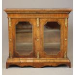 A VICTORIAN AND WALNUT MARQUETRY SIDE CABINET of oblong form crossbanded with gilt metal mounts, the