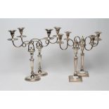 A PAIR OF EDWARDIAN PLATED ON COPPER TWO BRANCH CANDELABRA, the tulip sockets with detachable drip