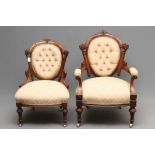 A PAIR OF LADY'S AND A GENTLEMAN'S VICTORIAN WALNUT SHOW FRAME EASY CHAIRS, button upholstered in