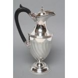 A LATE VICTORIAN SILVER CLARET JUG, maker H. Woodward & Co. Ltd., London 1898, of wrythen fluted