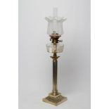 A SILVER PLATED TABLE LAMP, c.1900, the fluted column supporting a diamond and slice cut clear glass