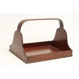 A GEORGIAN MAHOGANY BOOK TRAY, c.1800, of oblong form, the shaped raised ends rising to a loop