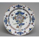 A BRISTOL DELFT SMALL CHARGER, c.1770, of plain circular form, painted in the Fazackerley palette