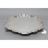 A SILVER SALVER, maker Manoah Rhodes, Sheffield 1927, of shaped circular form with pie-crust rim,