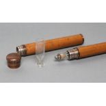 A VICTORIAN GENTLEMAN'S NOVELTY MALACCA CANE, the upper section with copper mounts (originally