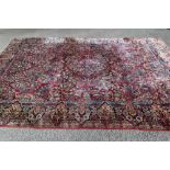 A PERSIAN CARPET, 20th century, the mid blue floral field with raspberry and pale blue gul and