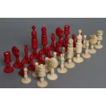 AN INDIAN TURNED BONE SMALL CHESS SET, 19th century, stained red and natural, Kings 3 1/2" high (