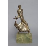 AFTER LORENZL - an Art Deco spelter figure modelled as a young fashionable lady wearing a daisy
