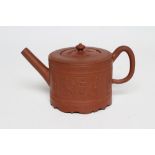 AN ENGLISH REDWARE TEAPOT AND COVER, mid 18th century, of cylindrical form with hand cut