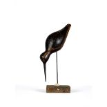 GUY TAPLIN (b.1939) "Godwit", a carved and painted model, 12 1/2" long, on a rustic metal support