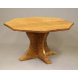 SID POLLARD OF THIRSK - an adzed oak dining table of octagonal form with mildly concave sides,