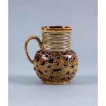 A NOTTINGHAM BROWN SALTGLAZE STONEWARE SMALL JUG, c.1720, of baluster form with engine turned