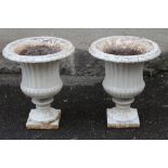 A PAIR OF SMALL VICTORIAN CAST IRON GARDEN URNS similar to previous lot, 16 1/2" x 19 1/2" (Est.