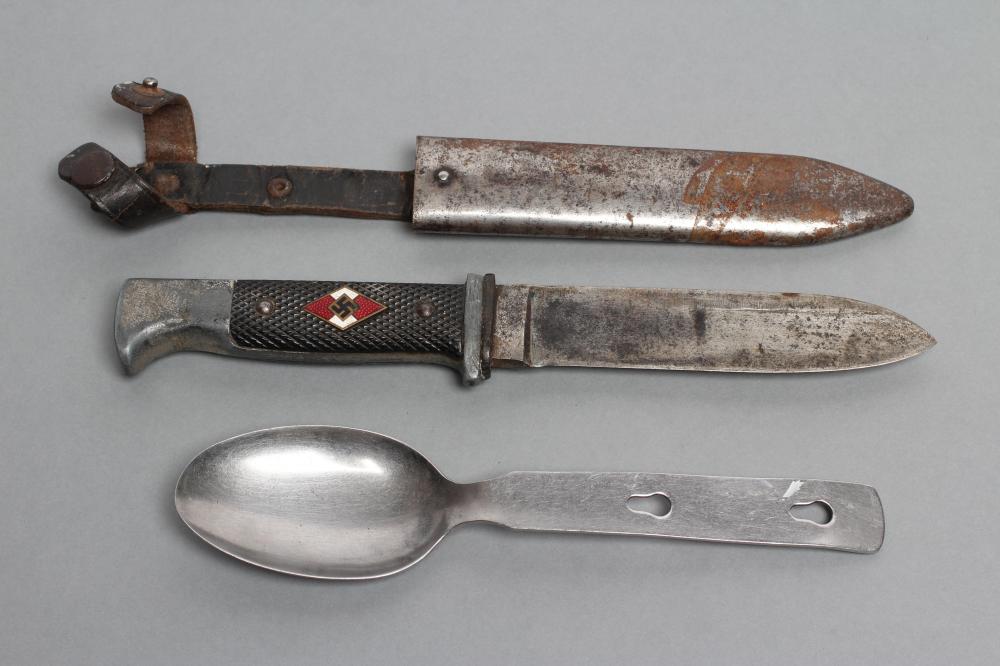 A HITLER YOUTH KNIFE, with 5" blade, third reich enamel lozenge to grip and metal sheath with