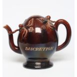 A ROCKINGHAM BROWN GLAZED STONEWARE CADOGAN TEAPOT, c.1830, of typical form with moulded and applied