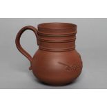 AN ELERS TYPE REDWARE MUG, early 18th century, the plain cylindrical upper section with three double