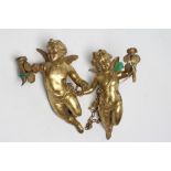 A PAIR OF GILT BRONZE FIGURAL LIGHT PENDANTS in the form of flying cherubs each holding a torch, the