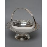 A SILVER BASKET, maker's mark rubbed, Birmingham 1945, of circular form, the everted rim stamped and
