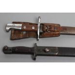 TWO EARLY 20TH CENTURY BAYONETS, comprising a Swiss M1918 by Waffenfabrik Neuhausen, with metal