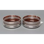 A PAIR OF SILVER BOTTLE COASTERS, maker C. J. Vander, Sheffield 1997, of plain cylindrical form with