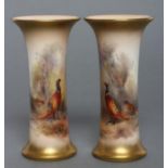 A PAIR OF ROYAL WORCESTER CHINA SMALL VASES, 1928, of waisted cylindrical form, painted in colours