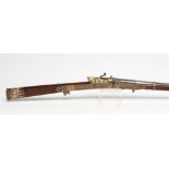 AN INDIAN MATCHLOCK TORADAR MUSKET, the 45" barrel flared at the bore with remnants of gilt design