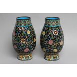 A PAIR OF CHINESE CLOISONNE ENAMEL VASES of baluster form, decorated in colours with