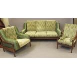 A FORMOSA TEAK LOUNGE SUITE, 1960's, comprising three seater settee, the slatted back with