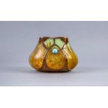 A SECESSIONIST GLASS VASE of lobed tapering oval form, in mottled amber and pale blue, with