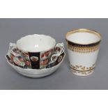 A FIRST PERIOD WORCESTER PORCELAIN WHEAT SHEAF CHOCOLATE CUP AND SAUCER, c.1770, the two handled