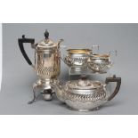 A LATE VICTORIAN SILVER FOUR PIECE TEA SERVICE, maker possibly Henry Stratford, Sheffield 1893, of