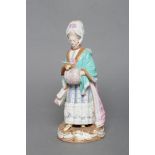 A MEISSEN PORCELAIN FIGURE, late 19th century, modelled as a young lady wearing a lace trimmed