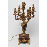 A LOUIS XV STYLE SIX LIGHT CANDELABRUM, in gilt metal and rouge griotte marble, the vase shaped
