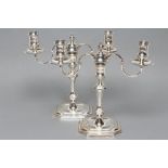 A PAIR OF GEORGE I STYLE SILVER TWO BRANCH CANDELABRA, maker's mark JCL, London 1969, the two scroll