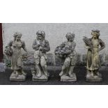 A SET OF FOUR COMPOSITION STONE FIGURES allegorical of the Seasons, each carrying produce, raised on