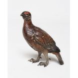 A COLD PAINTED BRONZE FIGURE OF A GROUSE, indistinctly marked, 3 1/2" high (Est. plus 21% premium