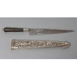 A SOUTH AMERICAN GAUCHO KNIFE, the 7 1/8" blade etched with flowers to the ricasso and horse head