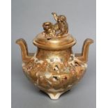 A SATSUMA EARTHENWARE KORO AND COVER of squat baluster form with two solid angular handles, on