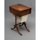 A REGENCY ROSEWOOD SEWING TABLE, the banded edged rounded oblong drop leaf top over a dummy and