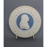 A VICTORIAN DRY BODIED ROUNDEL centrally applied with a bust portrait of Wesley on a blue ground