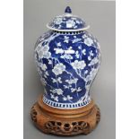 A CHINESE PORCELAIN JAR AND COVER of inverted baluster form, painted in underglaze blue with the